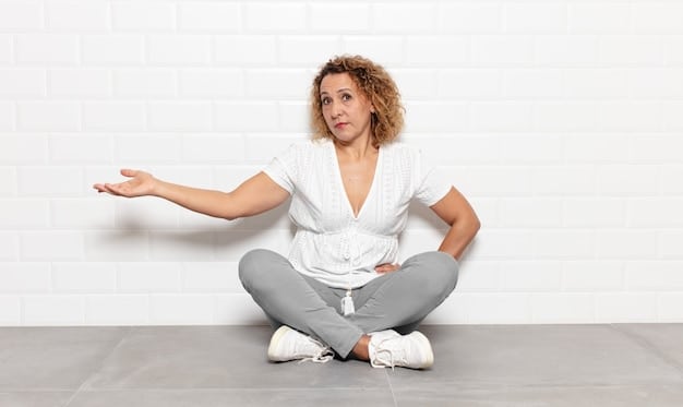 A person demonstrating a seated forward fold, with their hands reaching towards their feet. Emphasis on the correct posture and alignment.