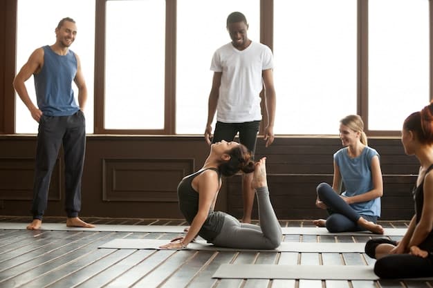 An adaptive yoga class in progress, showing participants of diverse ages and abilities using chairs and other props to support their poses, emphasizing inclusivity and accessibility.