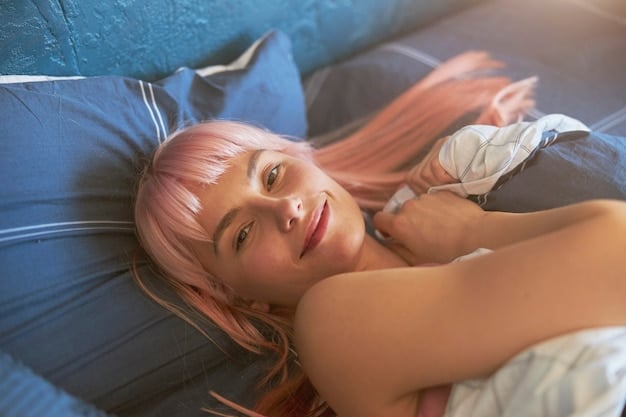 A close-up of a woman peacefully sleeping in bed, with soft, natural light filtering through the window. The focus is on her relaxed facial expression.
