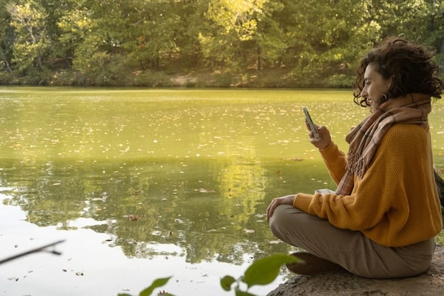 A person meditating outdoors in a peaceful setting, with their phone turned off next to them. The scene promotes mindfulness and disconnecting from technology to reduce stress.