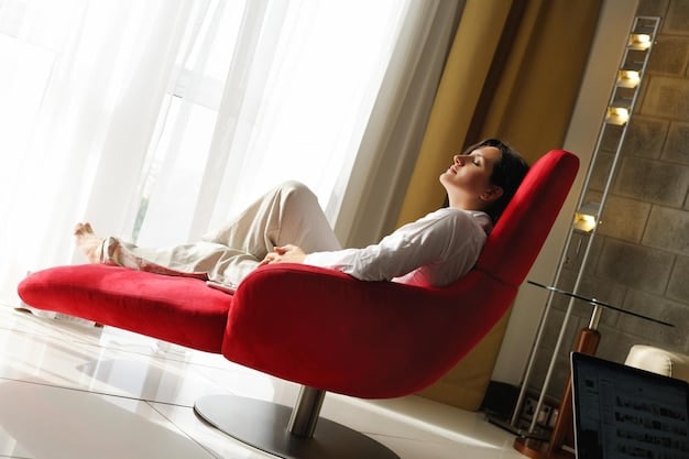 A person sitting comfortably in a chair, eyes closed, and taking a deep breath. The setting is a quiet and serene room with soft lighting, emphasizing the importance of a peaceful environment.