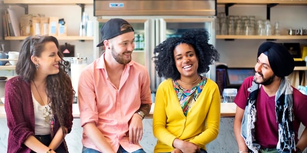 A diverse group of people smiling and expressing gratitude towards each other in a bright and airy office space, fostering a collaborative and positive work environment.