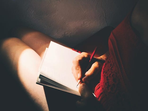 A close-up shot of hands writing in a journal with a pen, illuminated by warm light. The background is slightly blurred, focusing attention on the act of writing and the texture of the paper.
