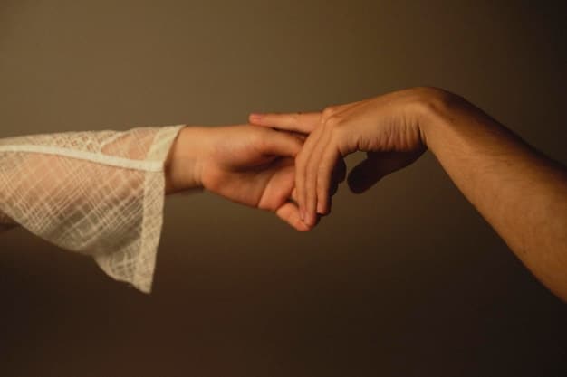 A close-up shot of two hands gently reaching out and touching, symbolizing reconciliation and understanding between two people in a soft, warm light.