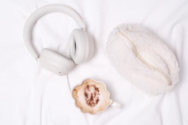 A close-up shot of a pair of noise-cancelling headphones resting on a cushion, with soft, indirect lighting creating a peaceful and inviting atmosphere. The focus is on the headphones, symbolizing the use of sound to create a meditative space.