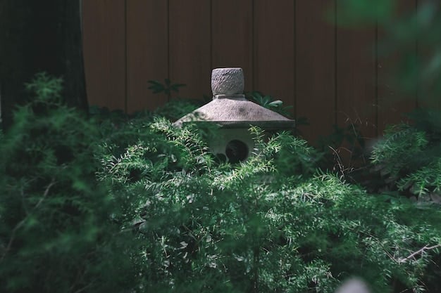 A close-up shot of a weathered stone lantern in a zen garden, with soft, diffused light illuminating the intricate details. Moss and lichen cover parts of the stone, suggesting age and history.