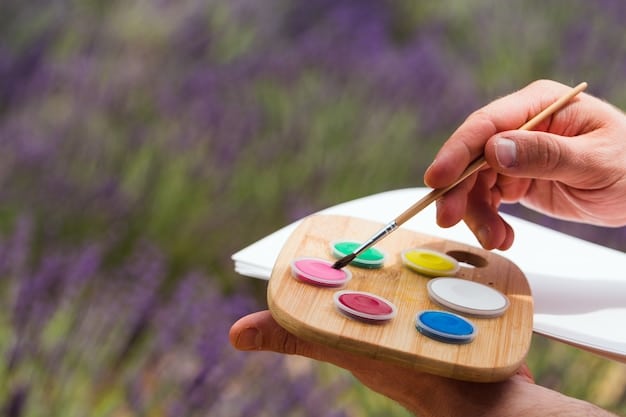 A close-up of a painter's hands gently mixing colors on a palette, reflecting the sense of calm focus and purposeful action that Zen brings to creative work.