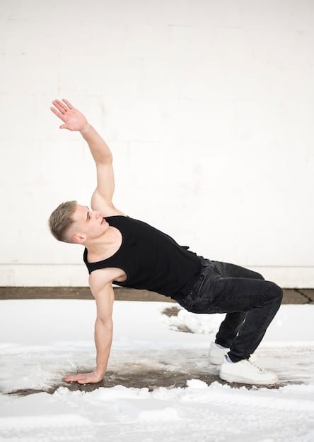 A person in a dynamic Power Yoga pose, such as a plank or a warrior pose, with sweat visible, indicating the intensity of the workout. They are focused and determined.