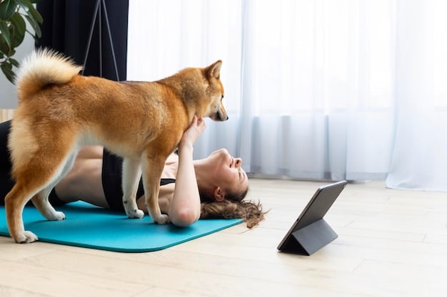 A person is using a tablet to follow a yoga class at home. They are in a modified version of downward-facing dog, with a yoga mat and block nearby. The room is bright and comfortable.