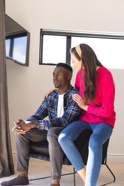 A person connected to biofeedback equipment being guided by a therapist in a calm setting, showing the interaction and personalized feedback during a biofeedback session.