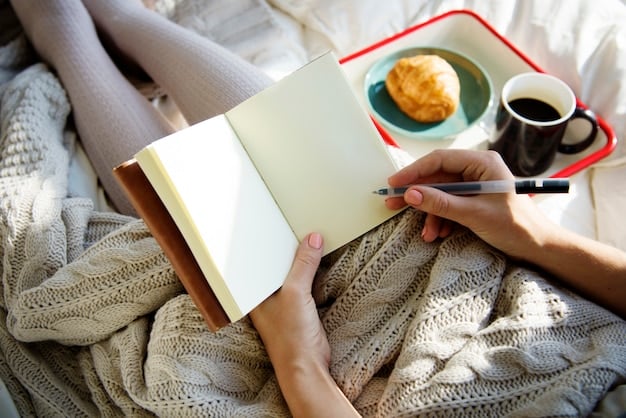 A person journaling in a cozy chair by a window, with sunlight streaming in. The journal is open, and a pen is in their hand.