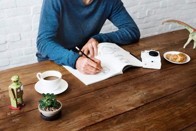 A person writing in a journal, reflecting on their experiences and planning for future growth, with a pen and notebook on a wooden desk.