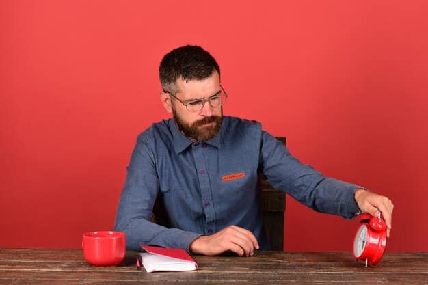 A person using a timer on their desk, with a notebook and pen nearby. The person is focused on their work, with a determined expression on their face. The timer represents the Pomodoro Technique.