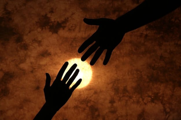 Two hands reaching out to each other, silhouetted against a warm, glowing background. One hand is slightly bruised, suggesting vulnerability, while the other offers support and connection, symbolizing forgiveness and reconciliation.