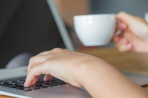 A close-up shot of a person's hands carefully typing on a laptop, with a cup of coffee and a notebook nearby. The focus is on the screen, which displays lines of code, suggesting the person is learning programming skills. The lighting is warm and inviting, creating an atmosphere of focused learning.