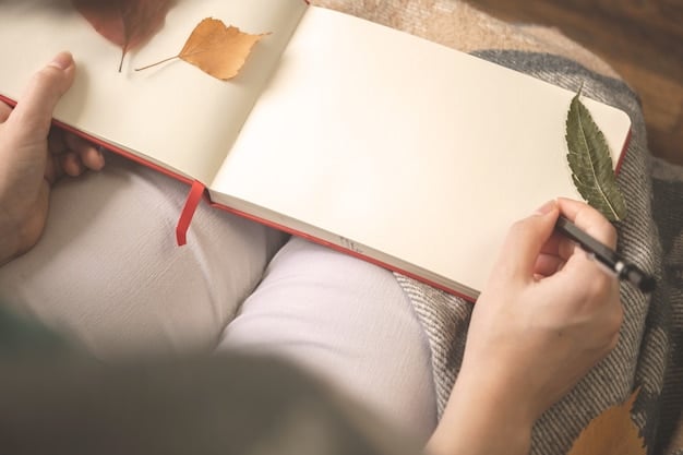 A close-up shot of hands holding a gratitude journal open to a page with handwritten entries. Small, cheerful drawings of flowers and symbols surround the text written in the journal. The background is blurred, bringing focus on the action of writing.