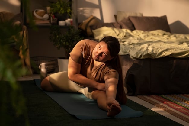 A person lying on their back in a reclined butterfly pose, with legs gently open and supported by pillows. Soft, warm lighting suggests nighttime.