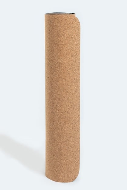 Close-up of a yoga mat made from natural cork, showcasing its texture and eco-friendly appeal, with a focus on sustainability and natural materials.