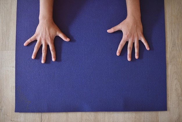 A close-up of a yoga practitioner’s hands and feet firmly planted on a mat, showcasing the precise alignment in a Trikonasana (Triangle Pose) during an Ashtanga yoga session, emphasizing the discipline and focus required.