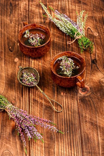 A visually appealing display of herbal teas, including chamomile, lavender, and peppermint, with fresh herbs and a calming background.