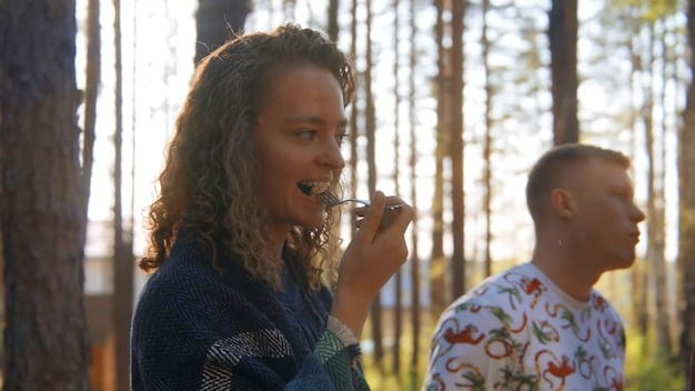 Two people having a calm and respectful conversation outdoors with emphasis on non-verbal such as posture and eye-contact. The lighting is diffused and even.