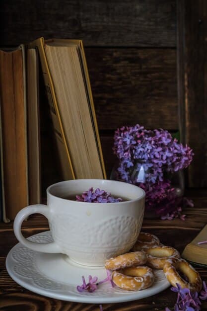 A cup of warm herbal tea (such as chamomile or lavender) sitting on a nightstand next to a book, with a soft, warm light in the background. The scene should convey a sense of coziness and relaxation.