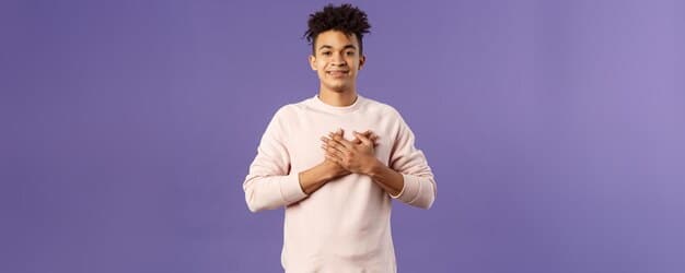 A person holding their hands over their heart in a gesture of self-compassion, with a warm and supportive facial expression.