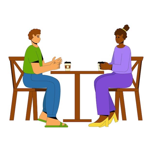 Two people sitting across from each other, engaged in a calm and open conversation. The setting is a sunlit room with plants, suggesting a peaceful and supportive environment. Focus on their eye contact and relaxed body language.