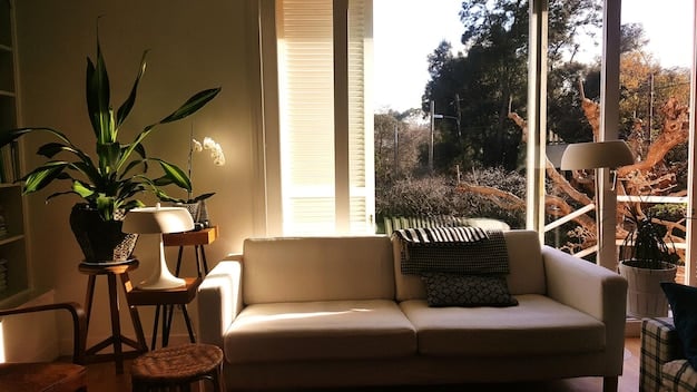 A minimalist living room with only essential furniture and decor; natural light is streaming in, creating a peaceful atmosphere.
