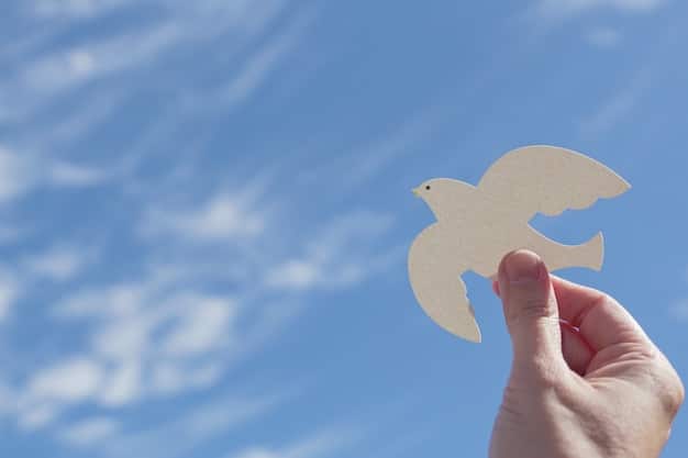 A close-up shot of hands gently releasing a white origami bird into the sky, symbolizing the act of letting go of resentment. The background is a soft, blurred blue sky.