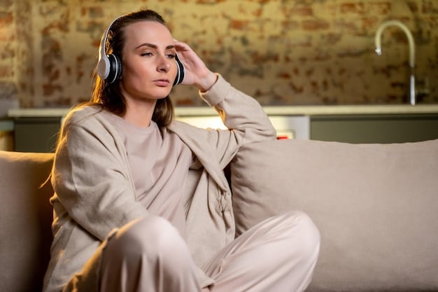 A person sitting in a comfortable chair, eyes closed, wearing noise-canceling headphones and holding a phone, but appearing relaxed and at peace. The room is dimly lit, with soft, ambient lighting, suggesting a peaceful environment for integrating technology mindfully.