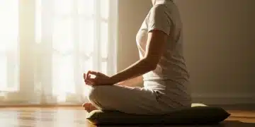 Person meditating peacefully in a sunlit room, calm and focused